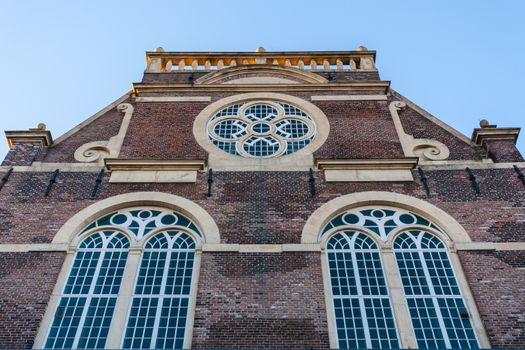 Church facade in Amsterdam with rose window