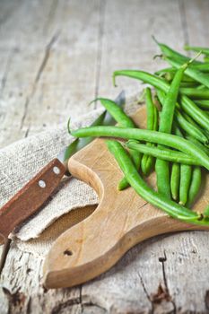 green string beans and knife