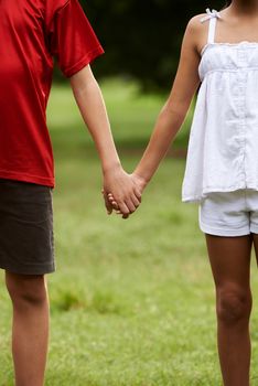 Children in love boy and girl holding hands