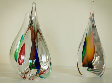 Three colorful glass sculptures