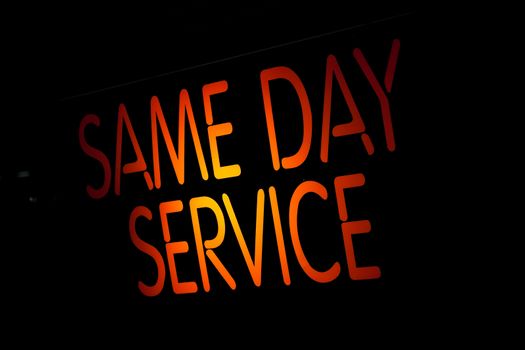 Neon Sign Same Day Service on Black Background