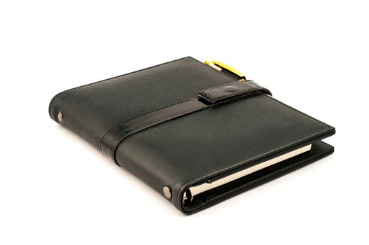 Black note book with ballpoint pen