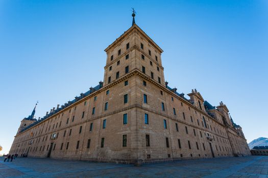 Full view of San Lorenzo de El Escorial Royal Site  taken from the big outdoors square showing its enormous architectural structure , Madrid Spain