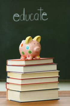 Piggy bank on a pile of books