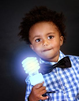 Little genius with illuminated lamp