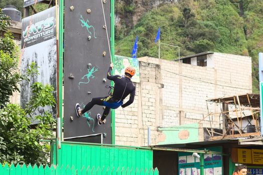 Abseiling on Climbing Wall in Banos, Ecuador