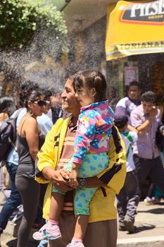 Spectators at the Carnival Parade in Banos, Ecuador