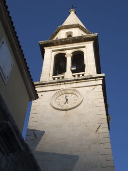 bell tower of St.John cathedral in Budva Montenegro just before sundown