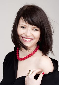 Young Beautiful Woman with Dark Brown Hair Smiling 