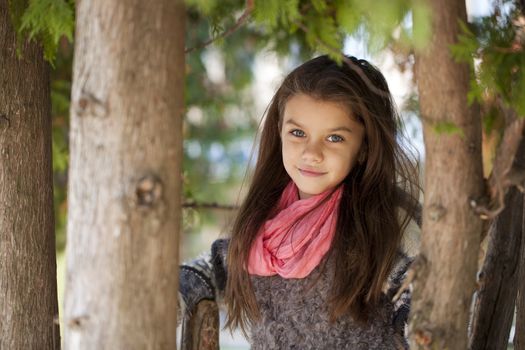 Beautifal little girl in the autumn park 