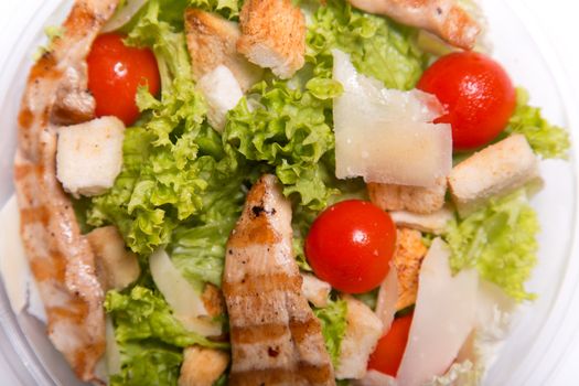 Delicious Caesar salad with grilled chicken meat 