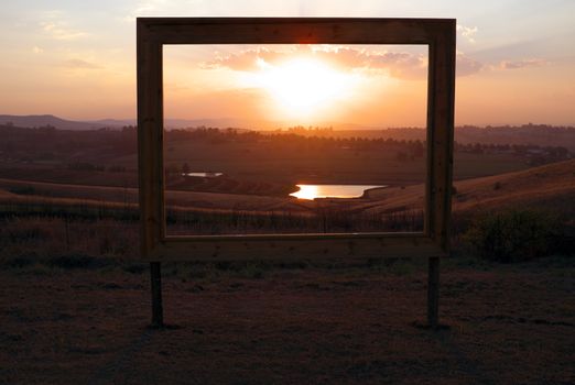 Framed African sunset in sales sign
