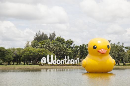 Large yellow rubber duck Symbols of peace Floating on the lake of the park.