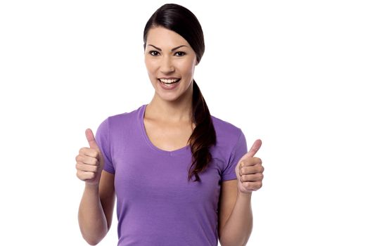 Smiling woman with thumbs up gesture