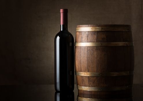 Bottle and a wooden barrel