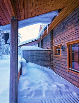 Terrace under snow in forest cottage2