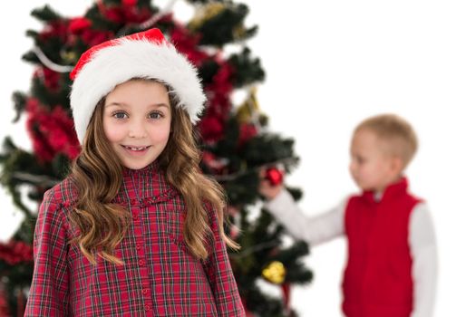 Festive little girl smiling at camera with boy behind