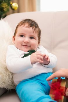 Cute baby boy on the couch at christmas