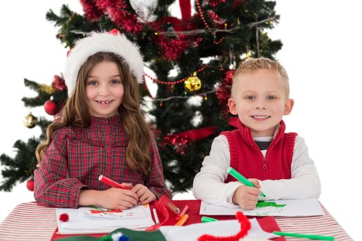 Festive little siblings drawing pictures