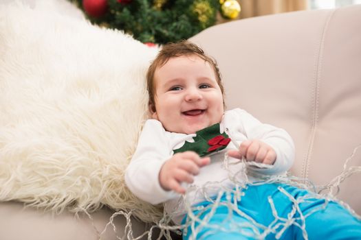 Cute baby boy on the couch at christmas