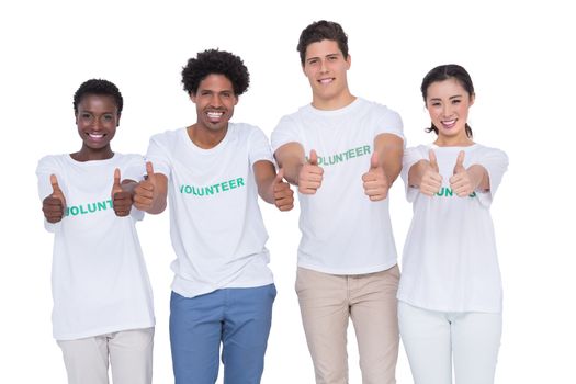 Young smiling volunteers looking at camera