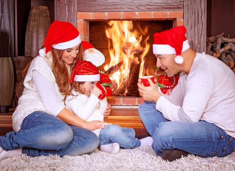 Happy family by fireplace