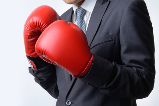 businessman with boxing glove ready to fight with problem, busin