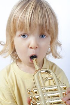 boy with toy trumpet
