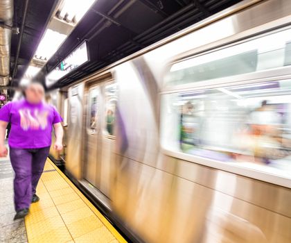 Blurred scene of fast moving subway train in Manhattan subway