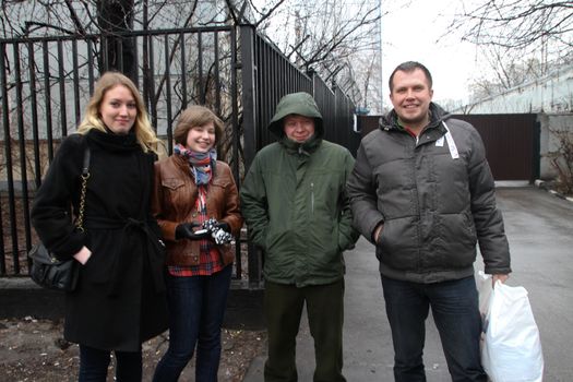 The politician Nikolay Lyaskin who is just released from under arrest is photographed against prison