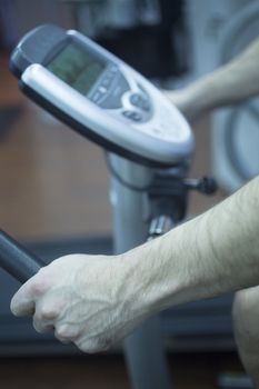 Young man on exercise bike