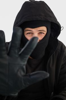 Portrait of burglar wearing a balaclava