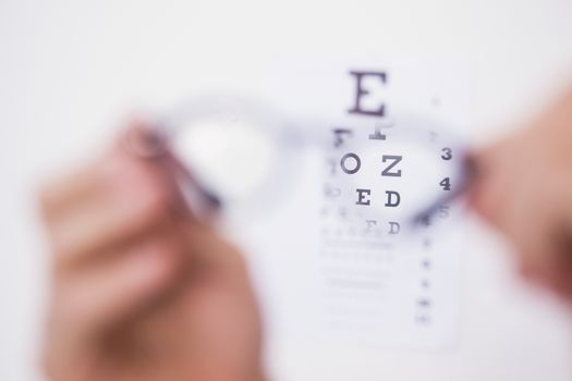 Reading glasses looking at eye test