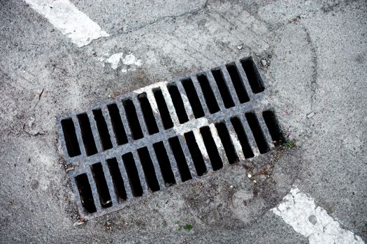 Drain grate with road marking line on it