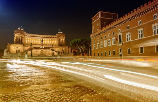 Car light trails in Venice Square at night, Rome