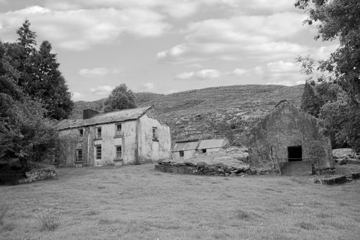 old abandoned farmhouse in the mountains of county Kerry Ireland in black and white