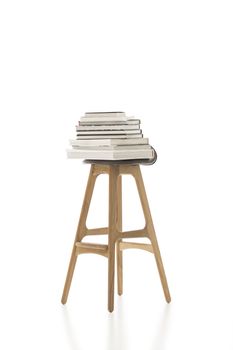 Piled Books on Top of Tall Single Chair