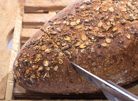 Knife Cutting Whole Grain Bread