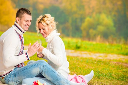 heterosexual couple relaxing cheerfully in the park