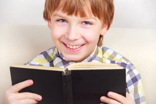 boy studying the scriptures.