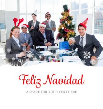 Composite image of portrait of a smiling business team wearing novelty christmas hat 