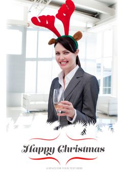 Composite image of smiling businesswoman with a novelty christmas hat toasting with champagne 