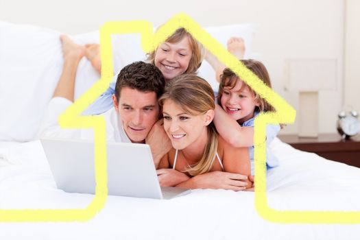Composite image of loving family looking at a laptop lying down on bed