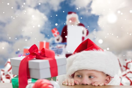 Composite image of cute boy looking at gifts