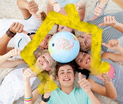 Composite image of teenagers on the floor with a terrestrial globe in the center and with thumbs up