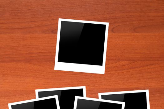 Blank Picture Frames on Wooden Table