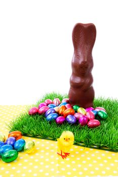 Easter scene with bunny and eggs on yellow napkin