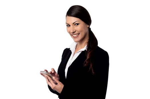 Smiling woman holding mobile phone