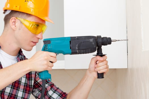 worker with drill