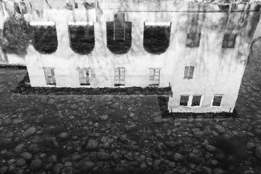 House reflection in water